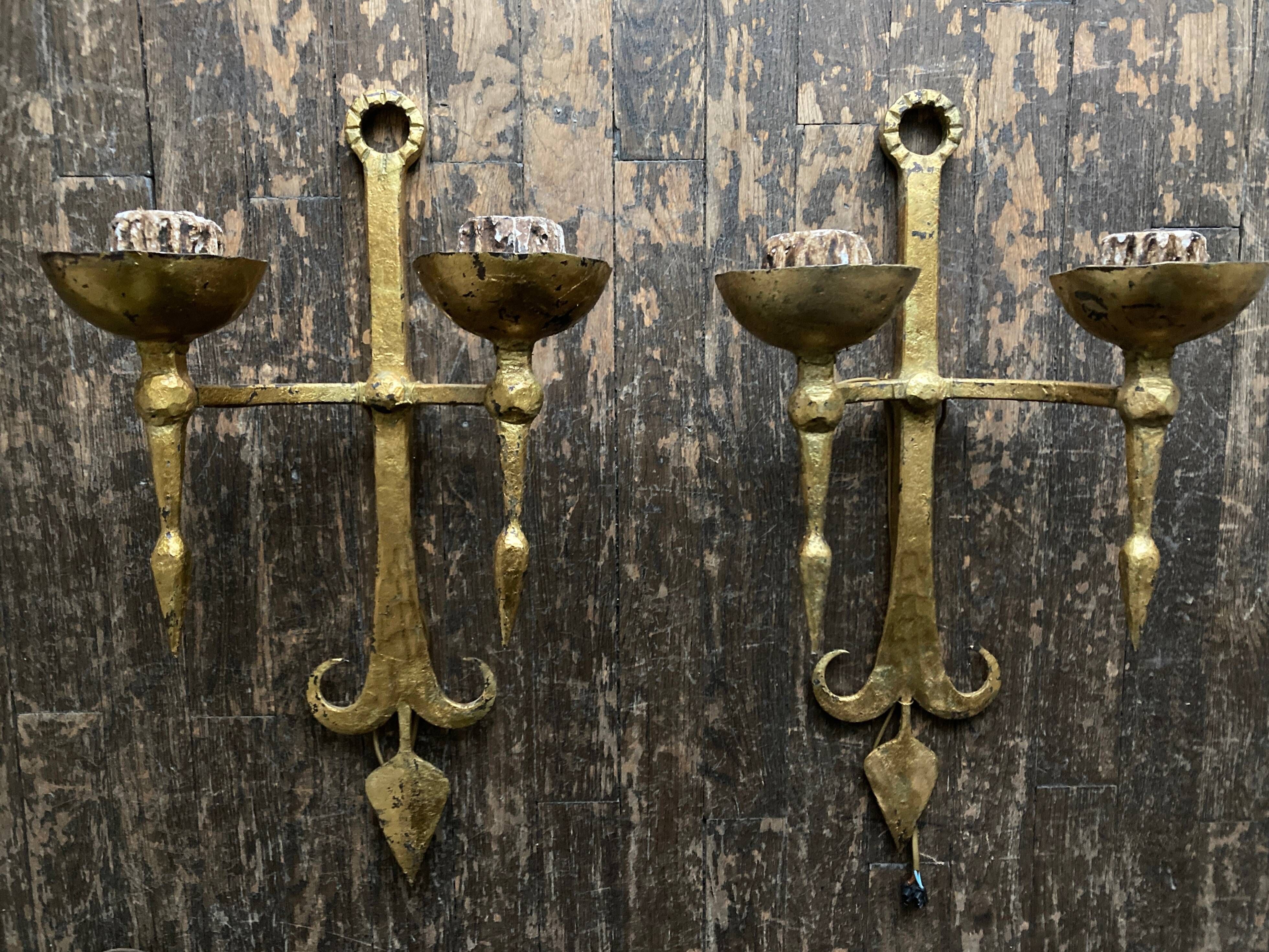 Pair of XXL torchlight sconces in golden beaten iron Italian work 1960