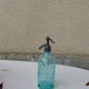 Turquoise blown and twisted glass siphon, Belle Epoque period, tin cap dated 1925, Boyer and Brush, Terre noire