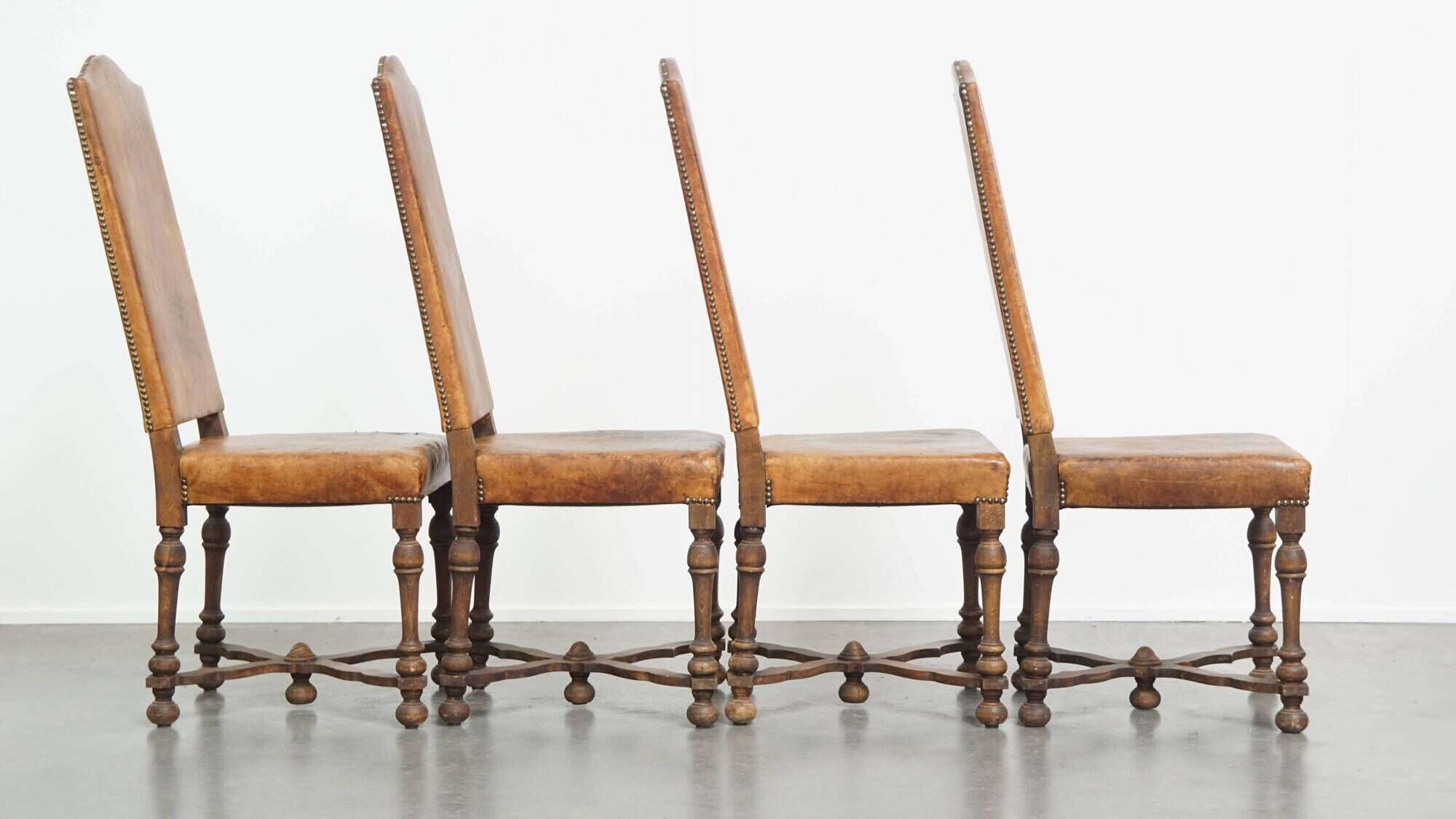 Set of 4 antique wooden and sheepskin leather dining chairs