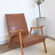 Fauteuil skaï et bois 50's