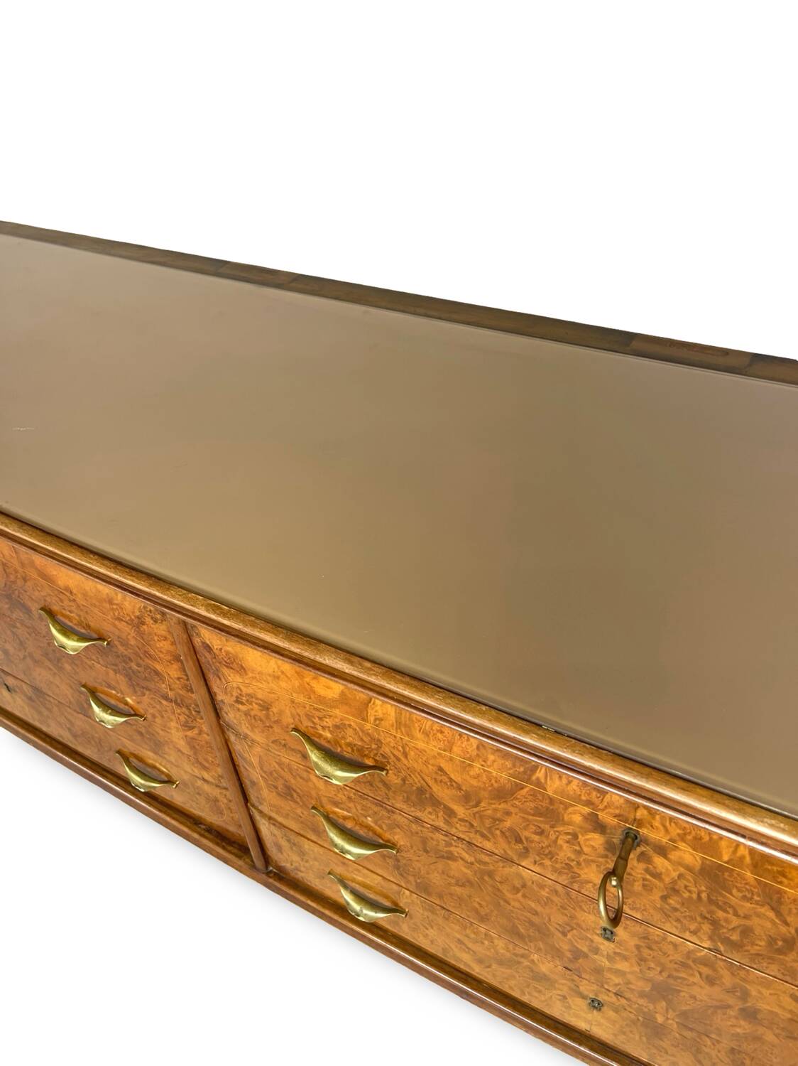 Veneered burl walnut chest of drawers with light warm brown glass top