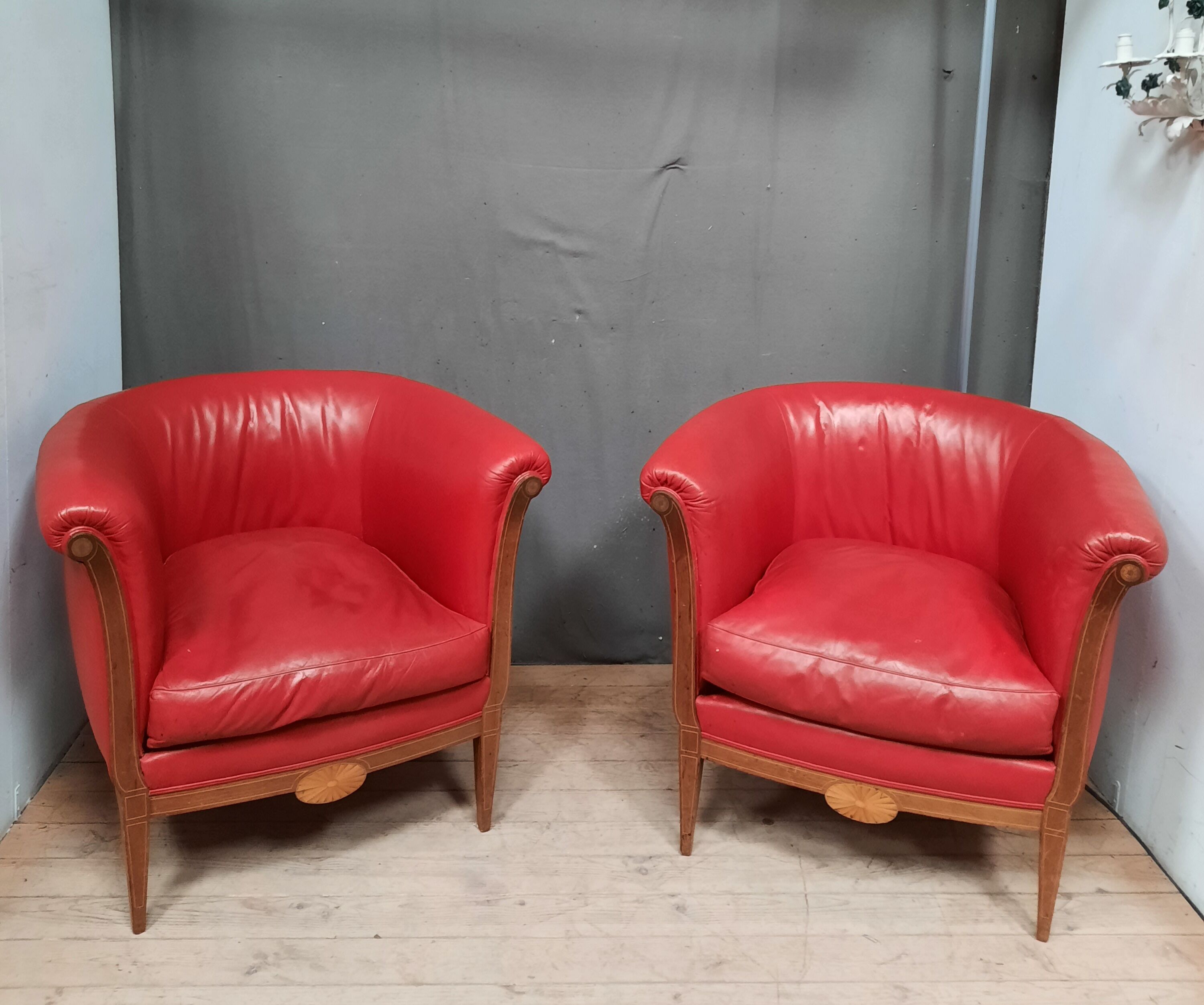 Pair of red leather armchairs