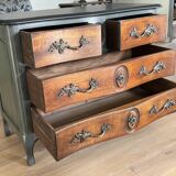 Curved patinated chest of drawers