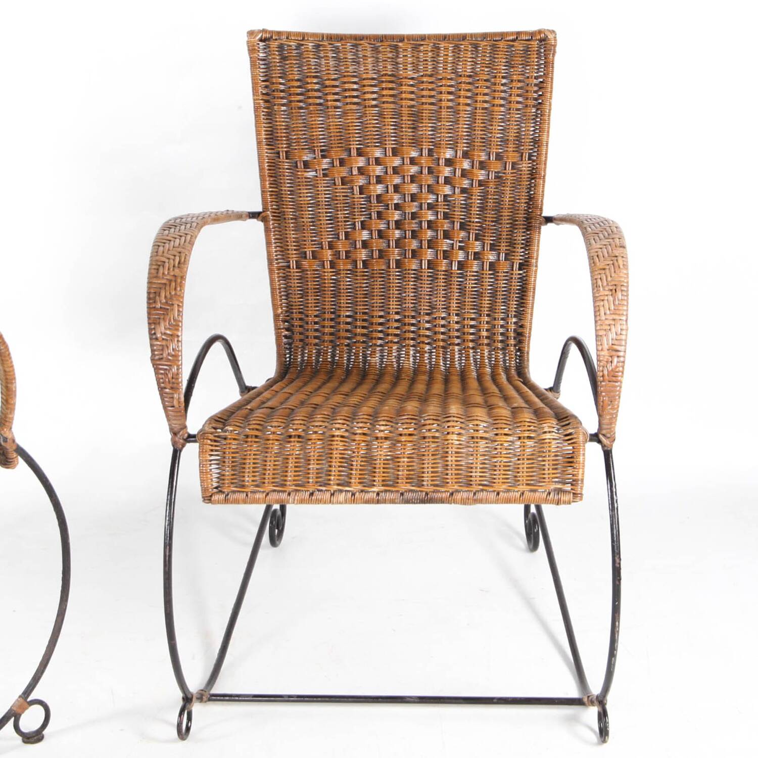 Pair of rattan and iron armchairs