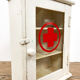 Vintage medicine cabinet red cross glass door