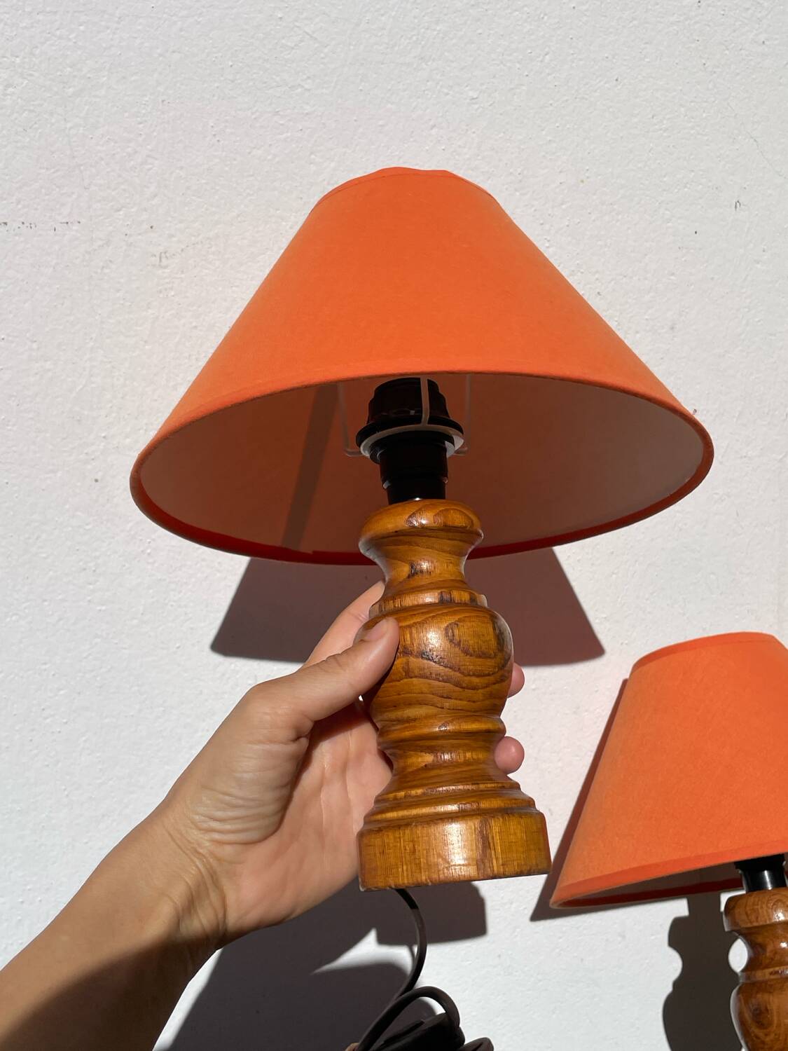 Pair of orange turned wood lamps