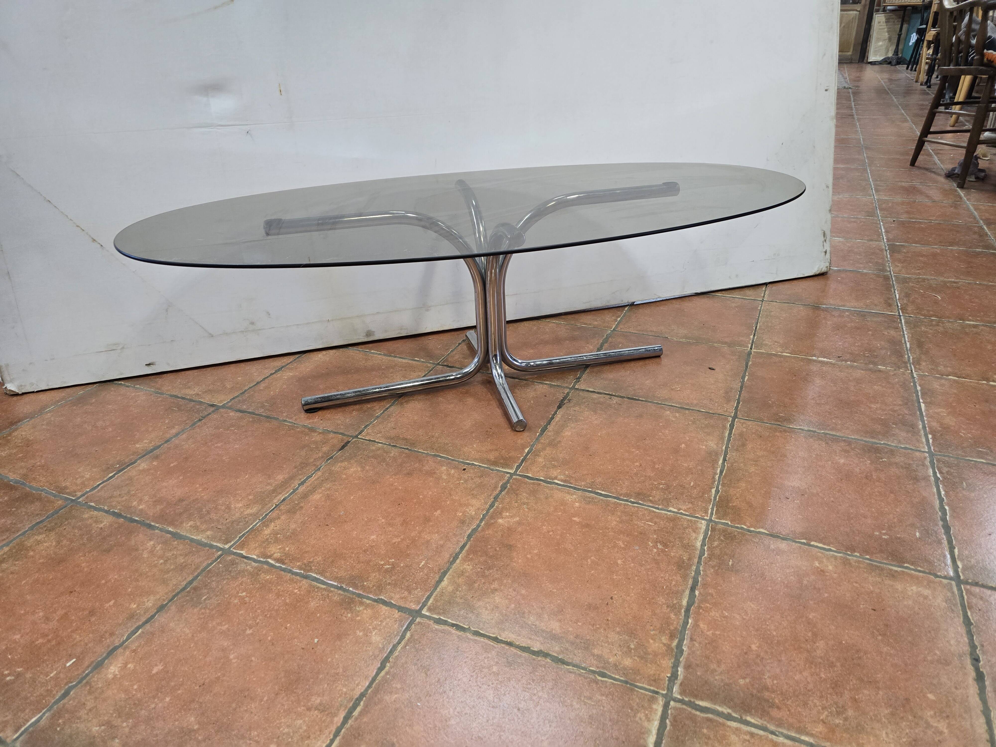 Coffee table with chrome base and smoked glass from the 70s