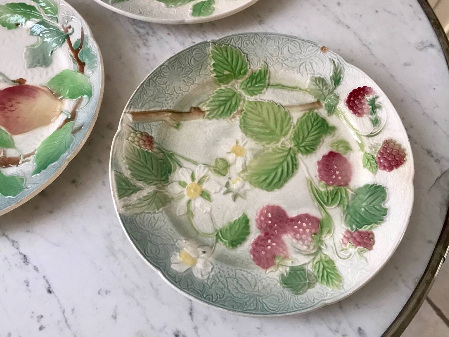 Trio of St Clement dessert plates in 19th century slip