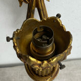 Bronze wall light, decorated with a bow and ribbon.