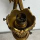Bronze wall light, decorated with a bow and ribbon.