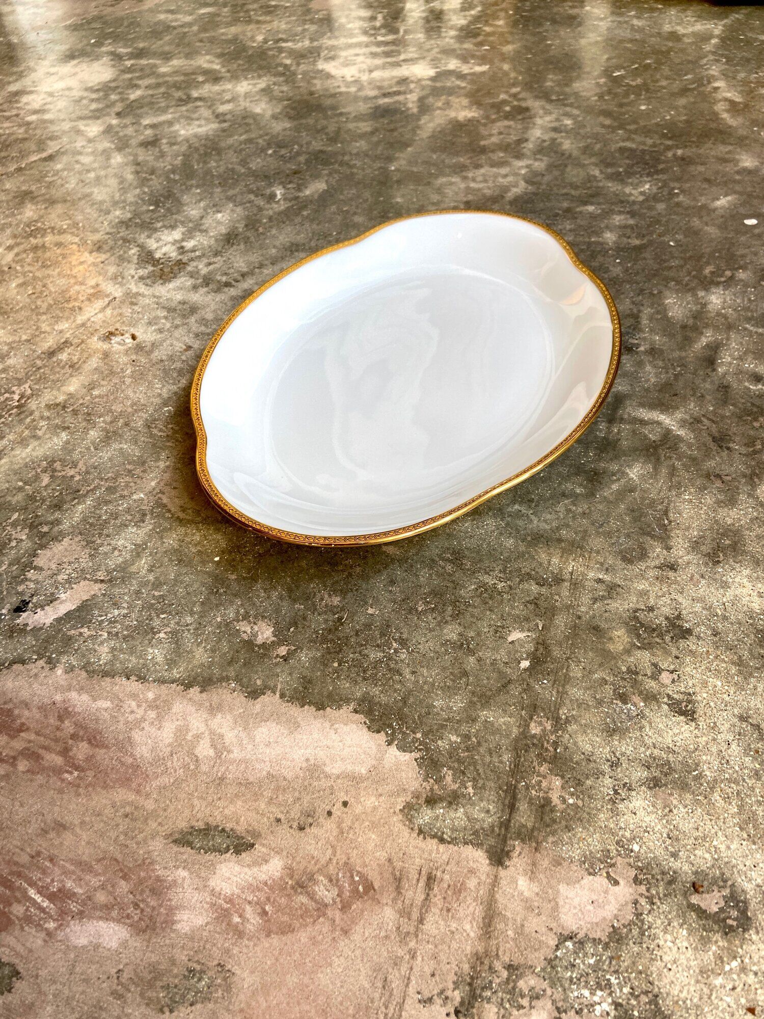Oval dish in white and golden Limoges porcelain