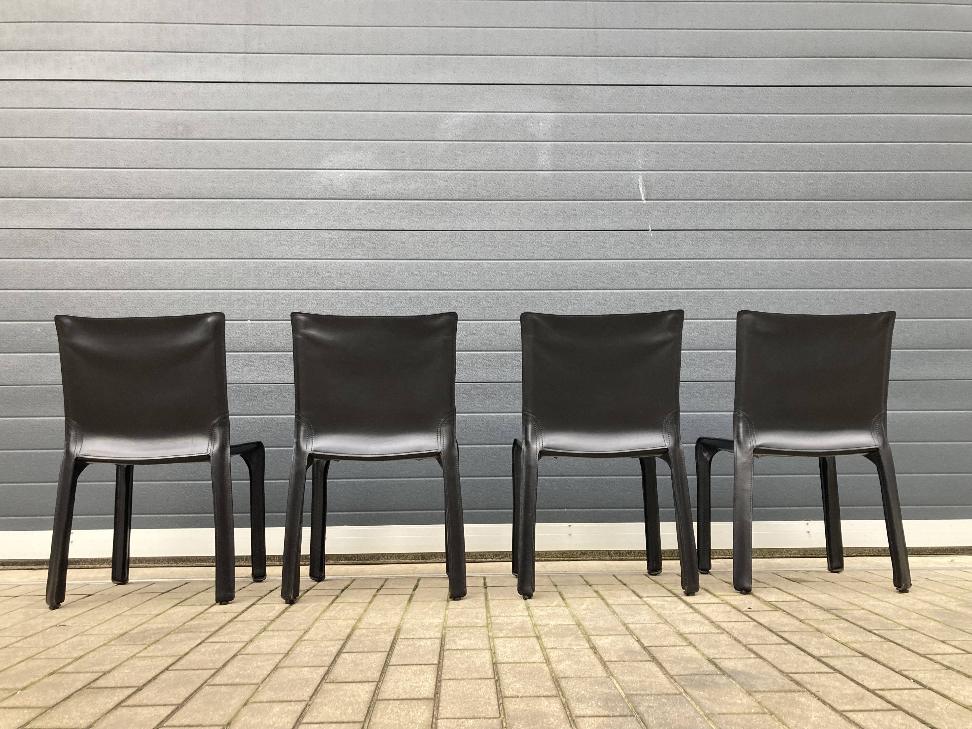 4 black Cassina Cab chairs by Mario Bellini