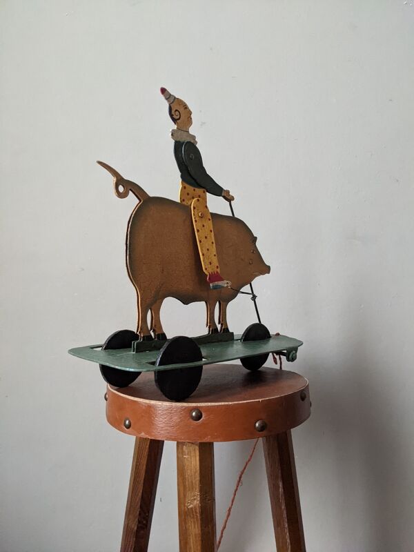Jouet ancien à tirer métal décor peint à la main clown cirque