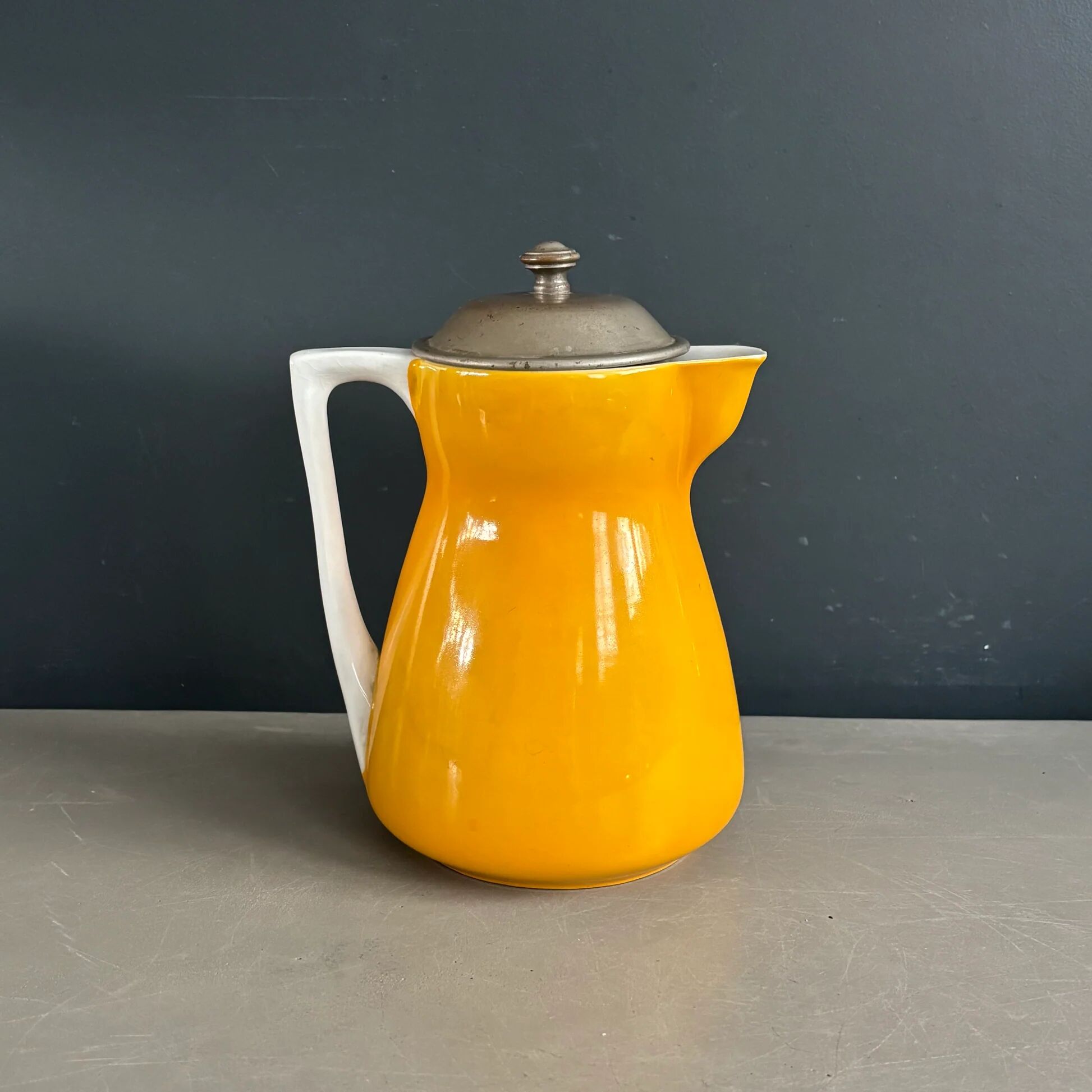 Antique teapot in earthenware with a tin filter lid.
