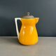 Antique teapot in earthenware with a tin filter lid.
