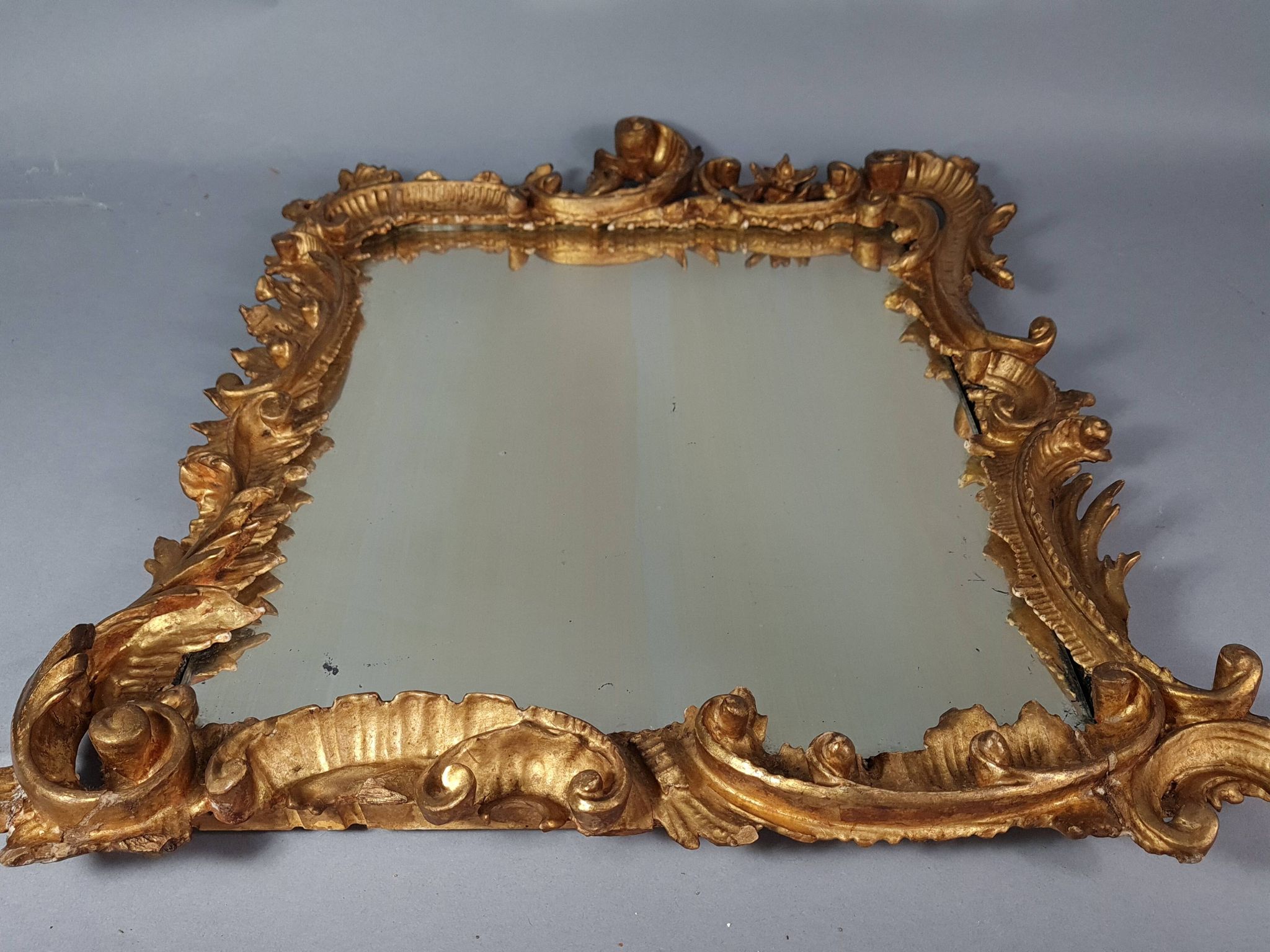 Mirror circa 1800, carved and gilded wooden frame, rocaille decoration, 54x39 cm, C227