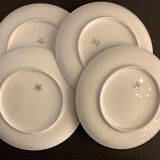 7 flat plates in porcelain of Limoges Bernardaud, decoration of golden Greek, XXth century