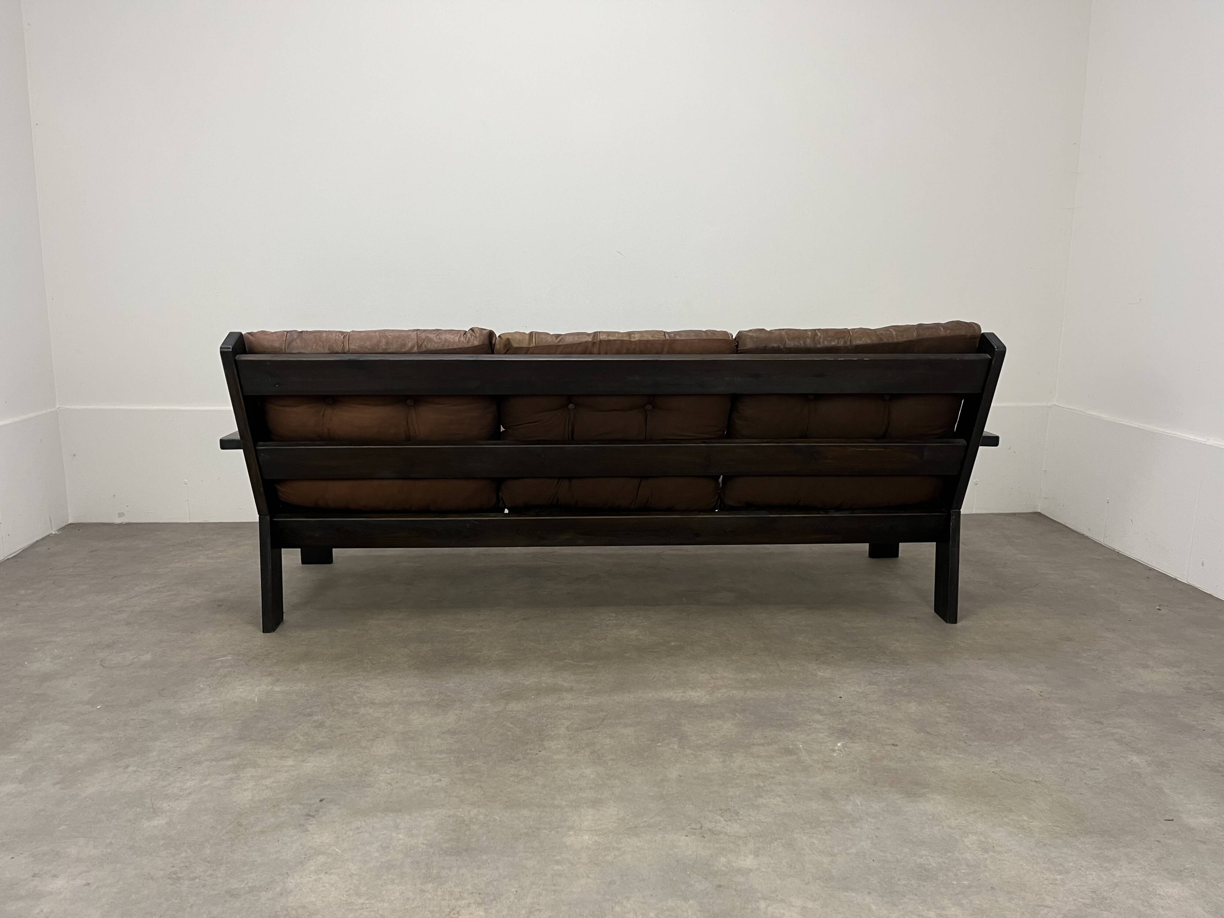 Living room sofa and brutalist armchairs in leather and wood, 70s, chalet style