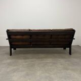 Living room sofa and brutalist armchairs in leather and wood, 70s, chalet style