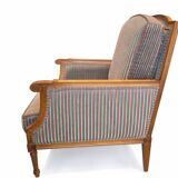 Armchair in the style of Louis XVI made of solid wood, striped fabric.