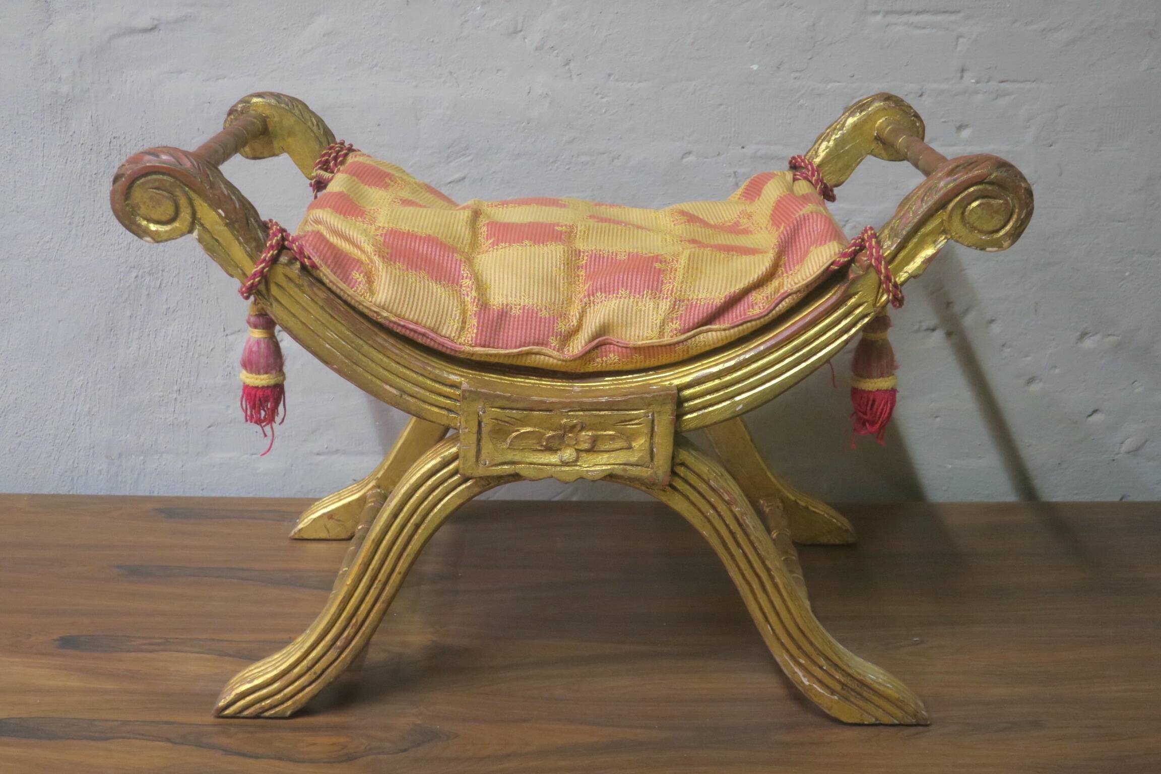 Antique parcel gilt cruciform stool