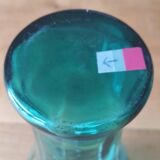 Blown glass vase with a flared neck and wavy rim.