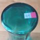 Blown glass vase with a flared neck and wavy rim.