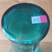 Blown glass vase with a flared neck and wavy rim.
