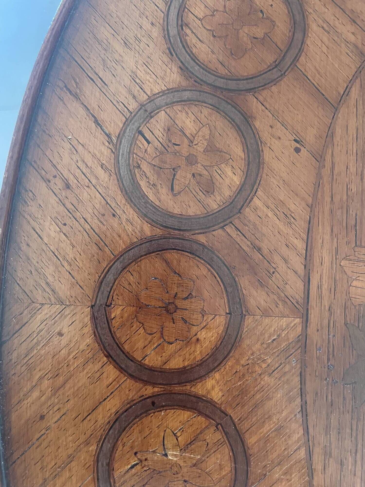 Oval bedside table from the Transition period in marquetry and bronze.