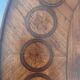 Oval bedside table from the Transition period in marquetry and bronze.