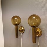 Set of solid brass wall lamps with smoked glass domes