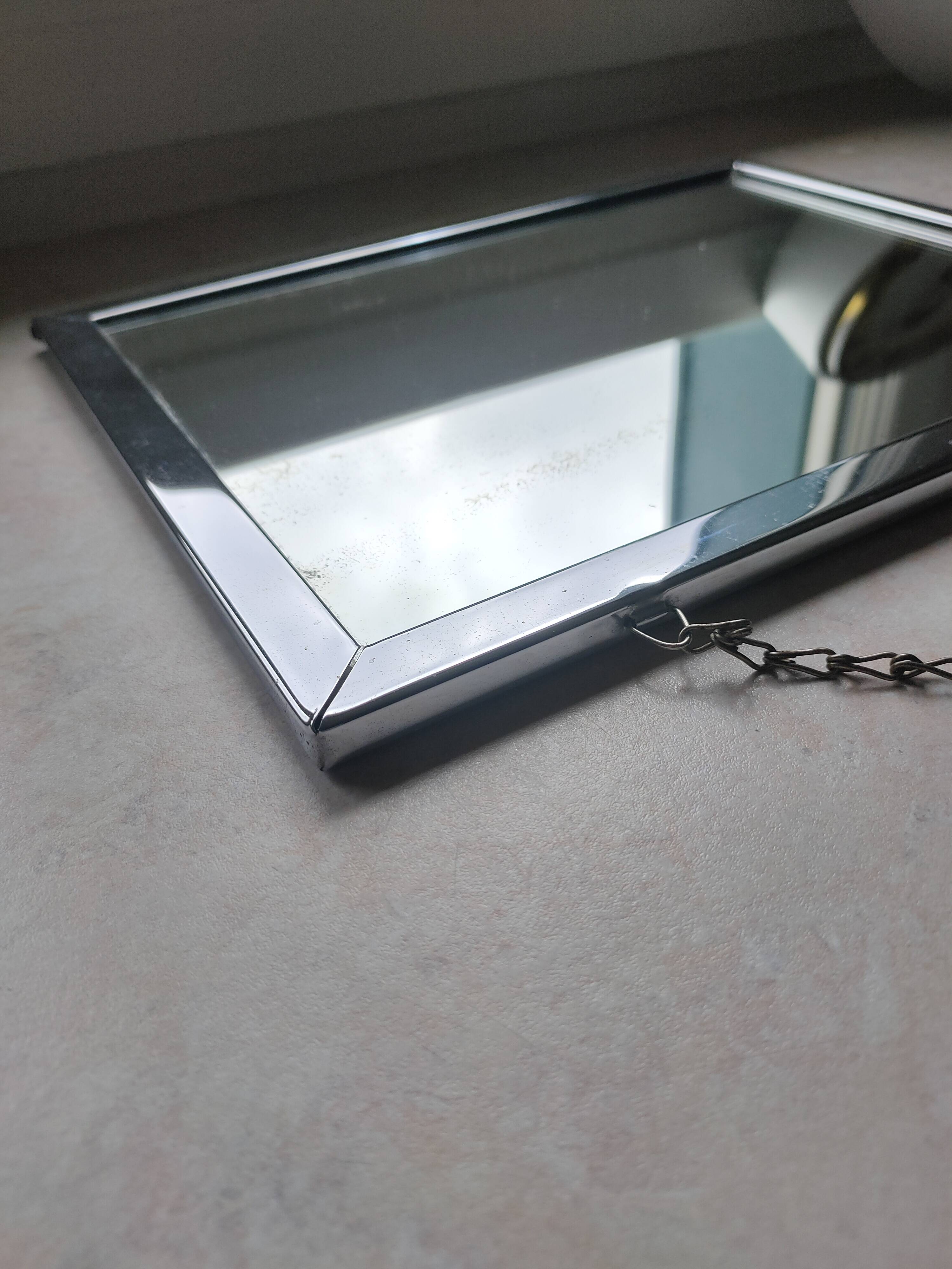 Barber mirror with chain.