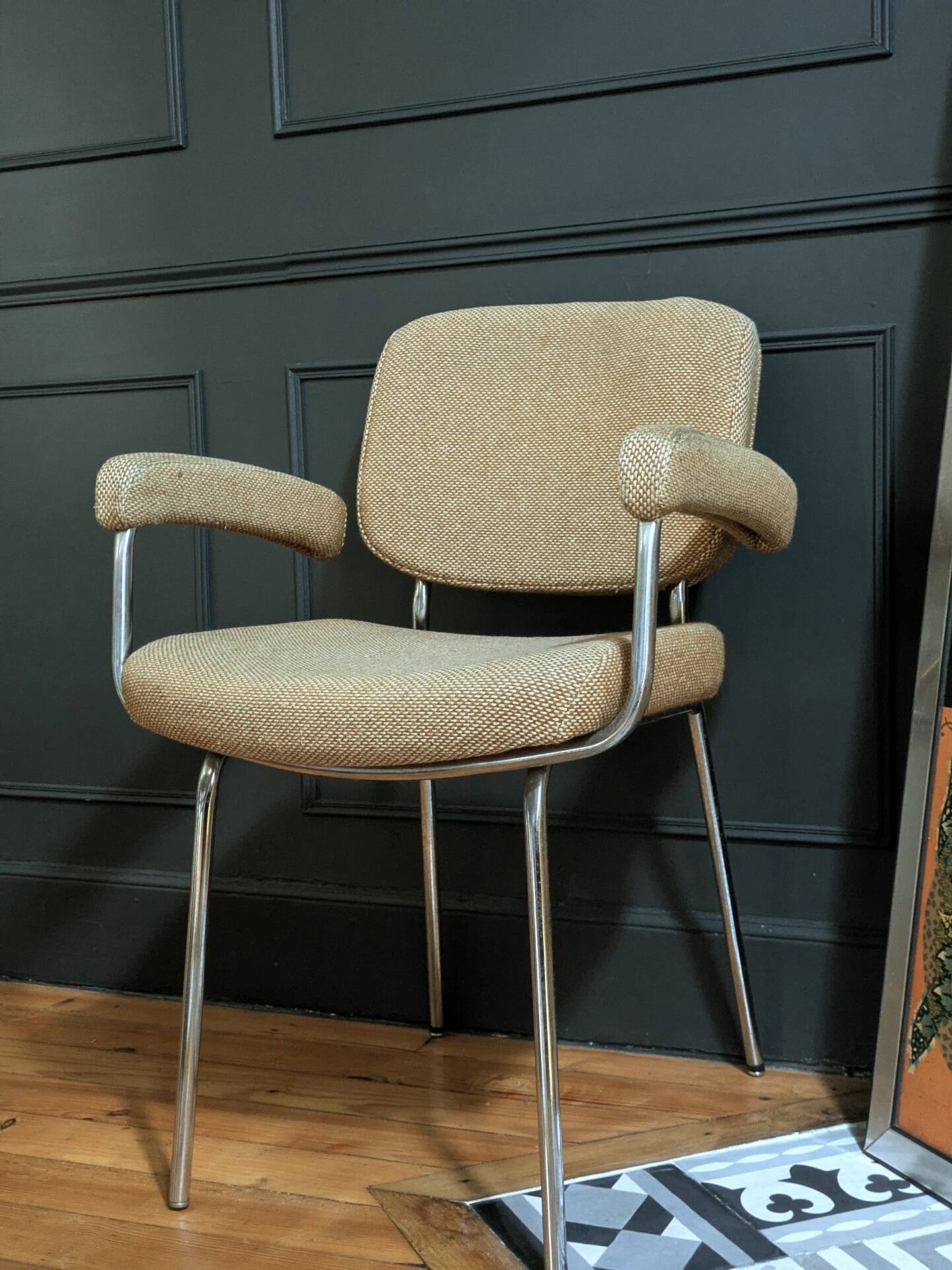 vintage tubular metal chrome office chair with patterned fabric.