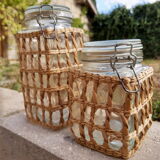 Pair of glass jars and rush