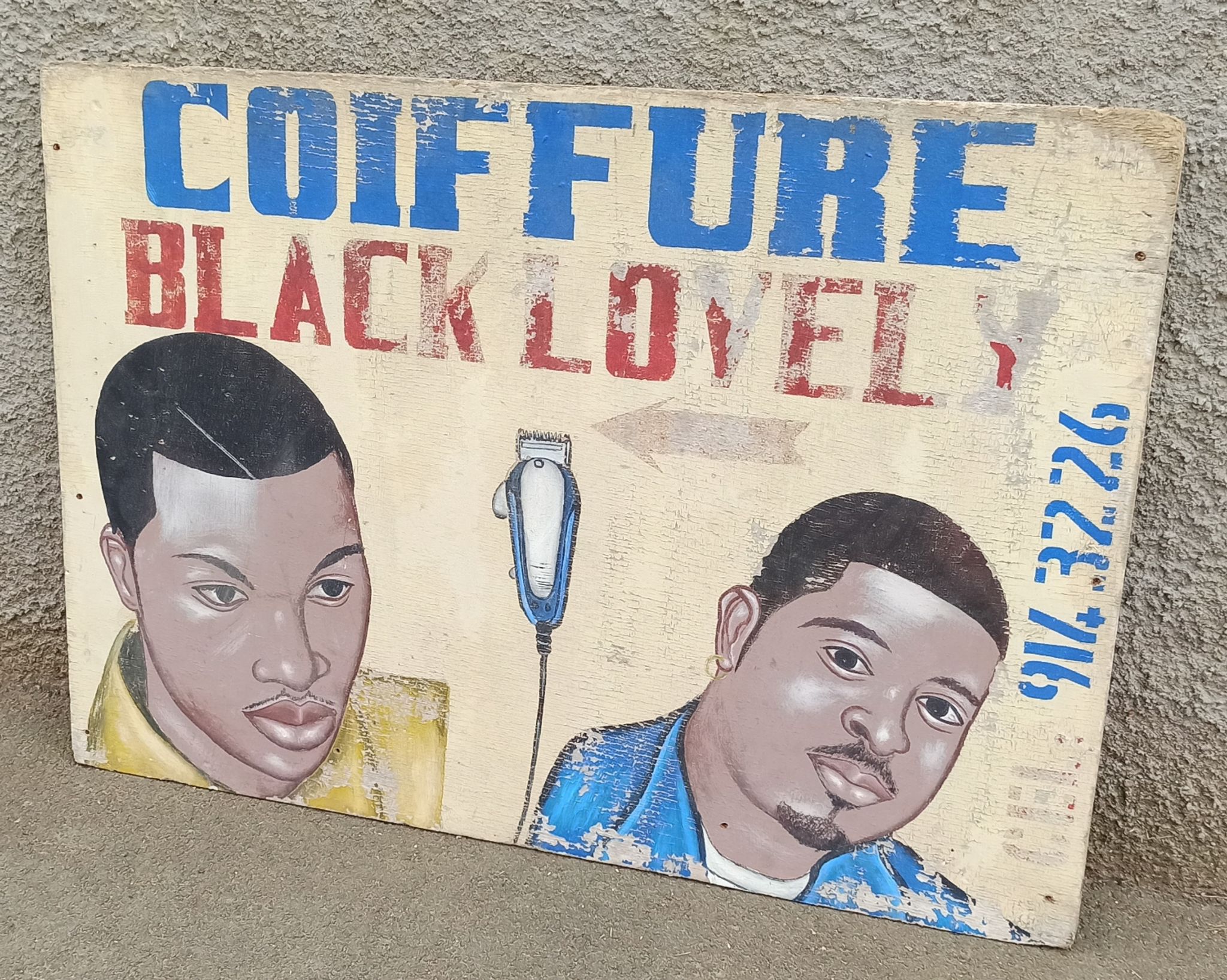 Ancienne enseigne de coiffeur africain