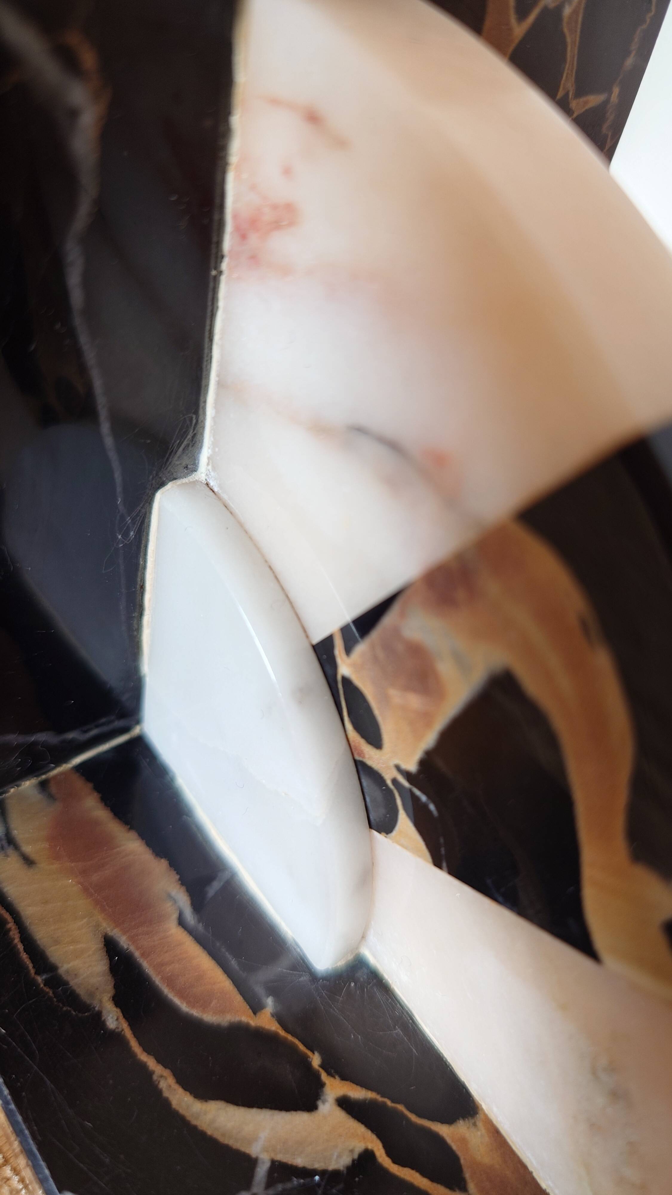 Art Deco pair of bookends in Portor marble and onyx, 1930s-1950s.
