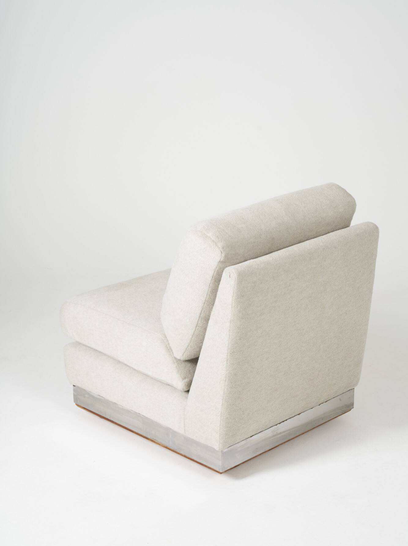 Beige fireside chair by Jacques Charpentier