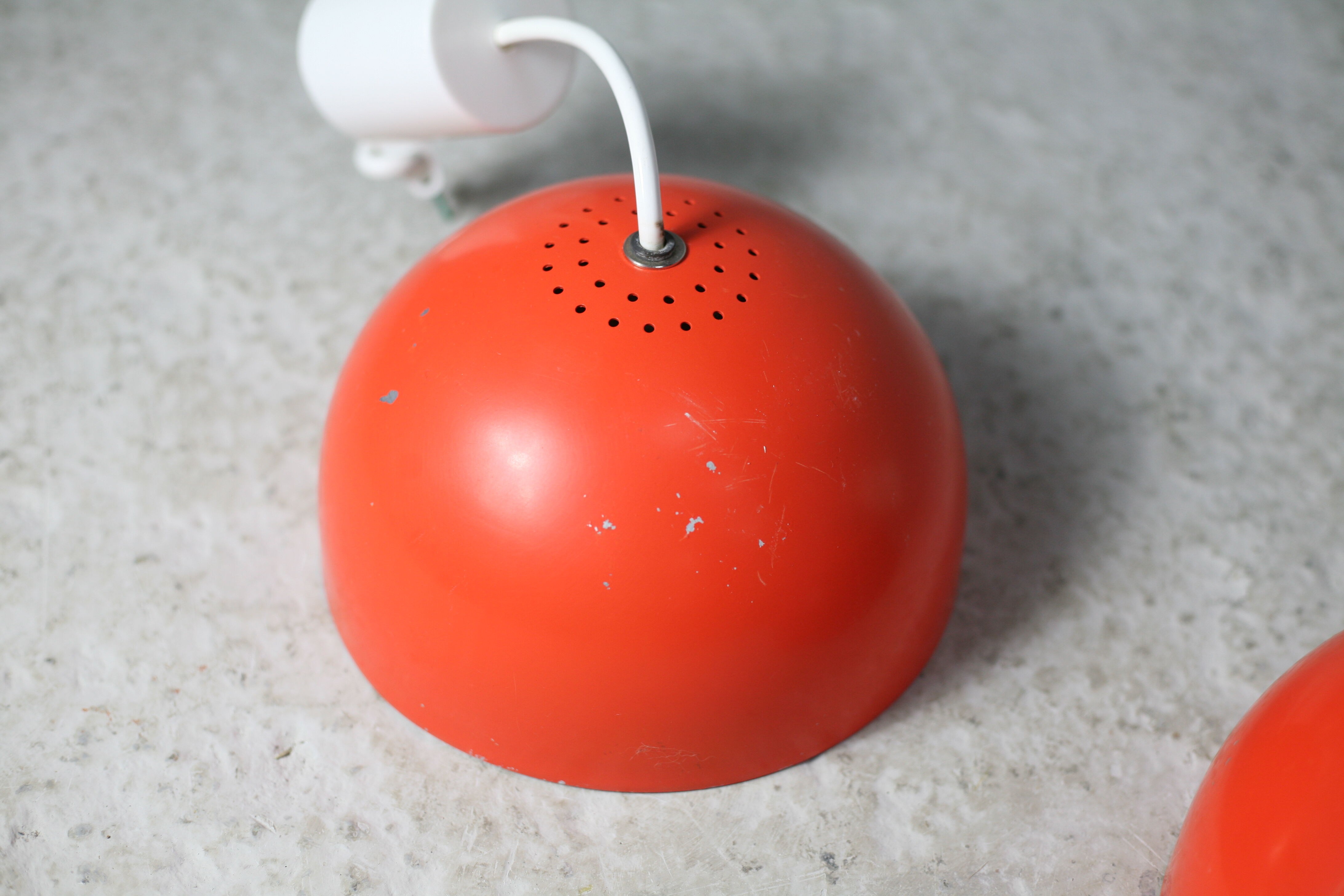 Set of 4 "spring" hanging lamps, orange steel, France, circa 1970