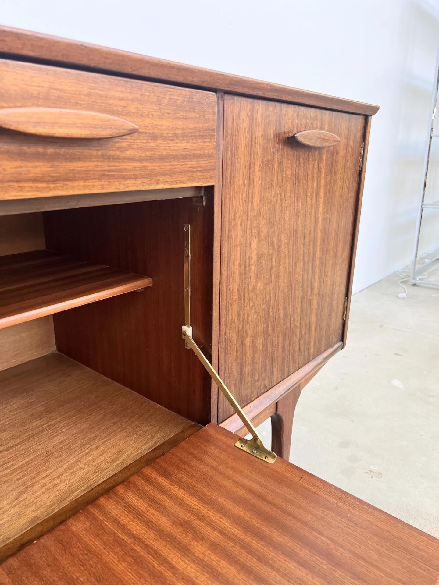 Teak Jentique sideboard — 1 door, 2 drawers & drop-down bar, England 1950s-60s