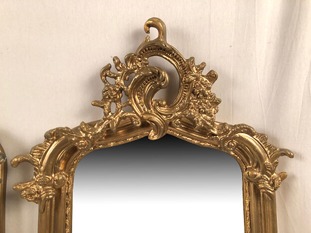 Pair of Louis XV style mirrors, stuccoed and gilded wood, beveled mirrors