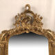 Pair of Louis XV style mirrors, stuccoed and gilded wood, beveled mirrors