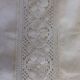 Linen sheet bordered by a wide lace and between two of lace
