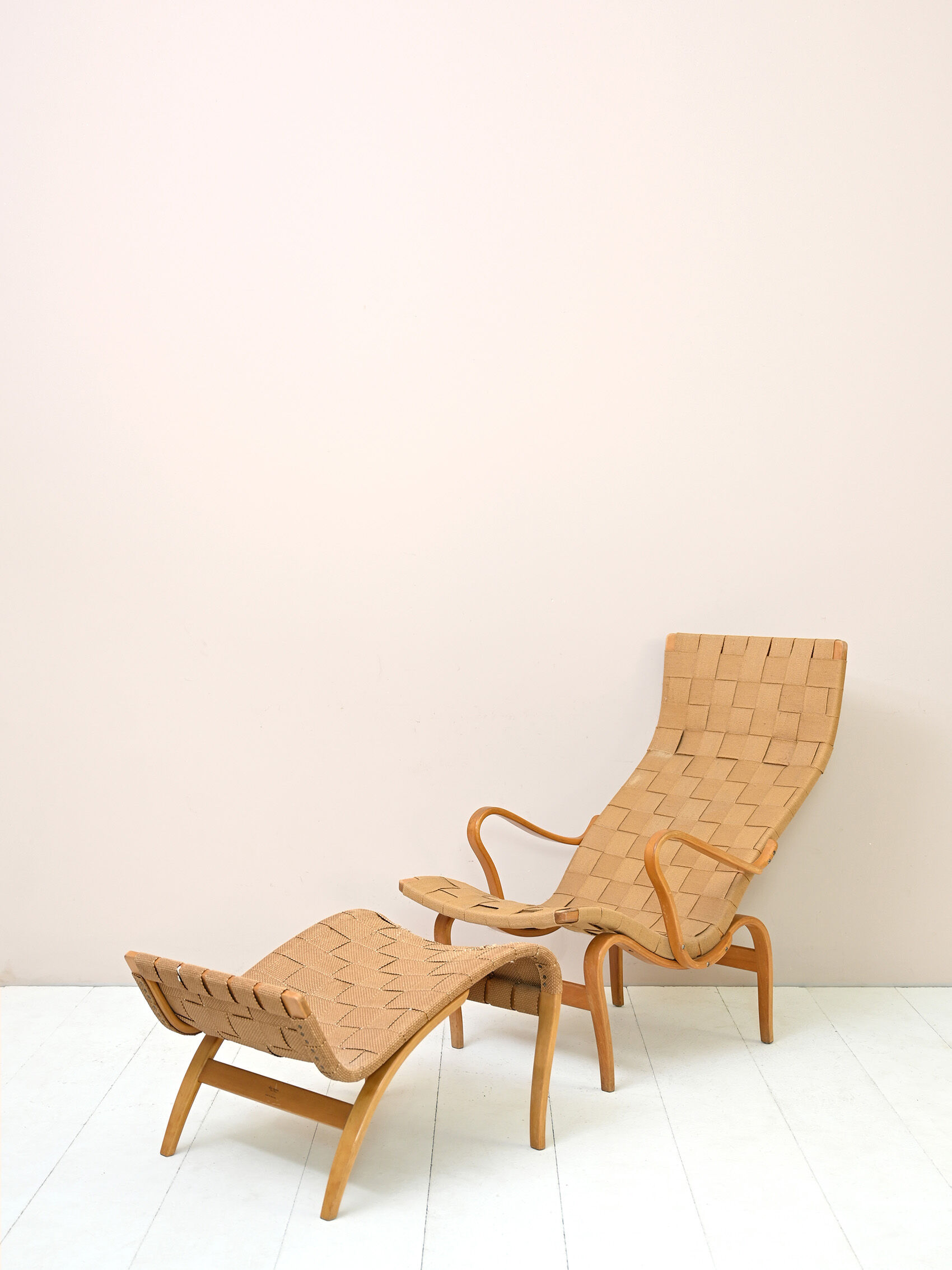 'Pernilla' armchair and footstool designed by Bruno Mathsson