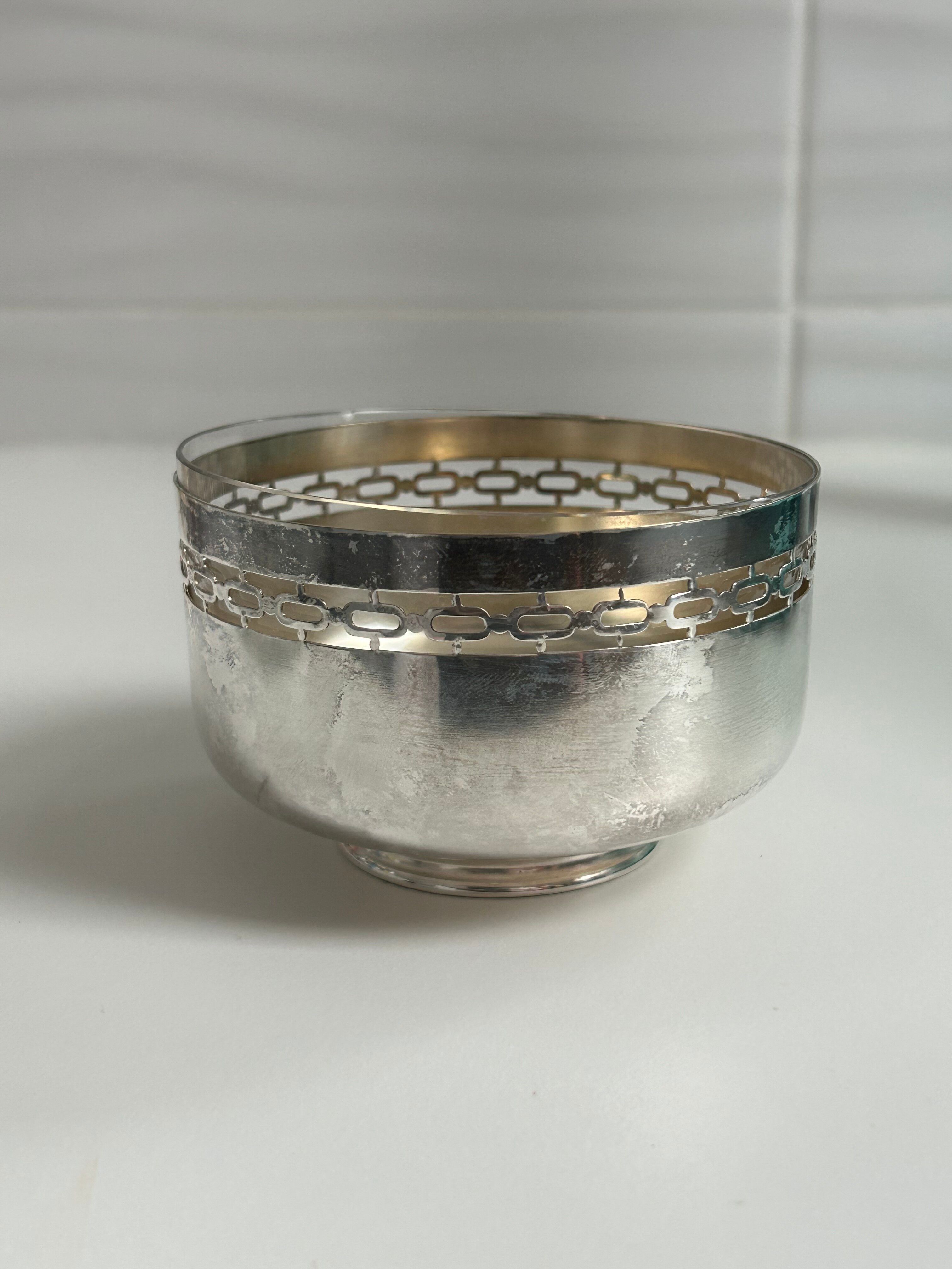 Vintage silver cup with a glass interior.