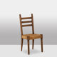 Ensemble de 8 chaises paillées en chêne. Années 1950.
