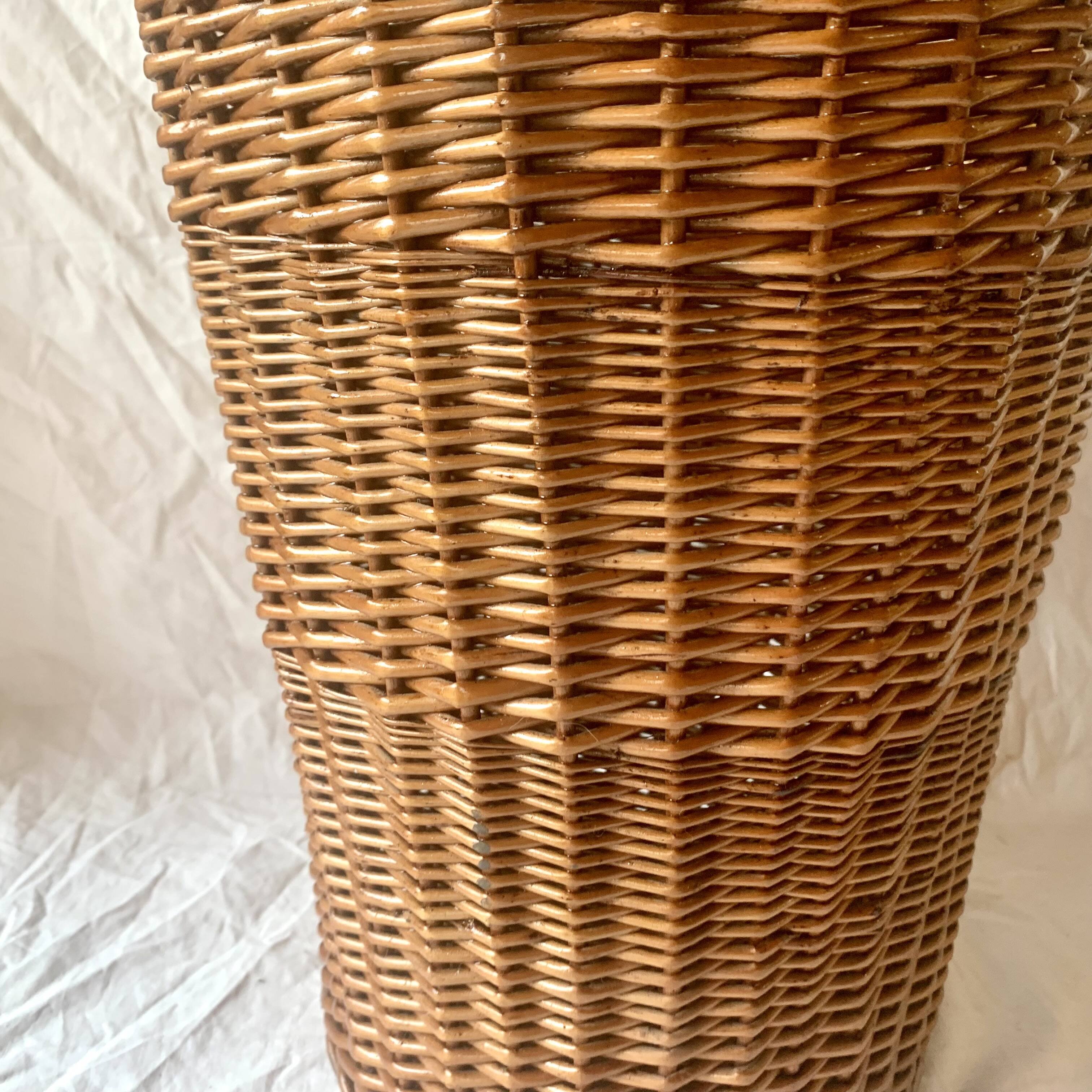 Old woven wicker umbrella stand