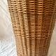Old woven wicker umbrella stand