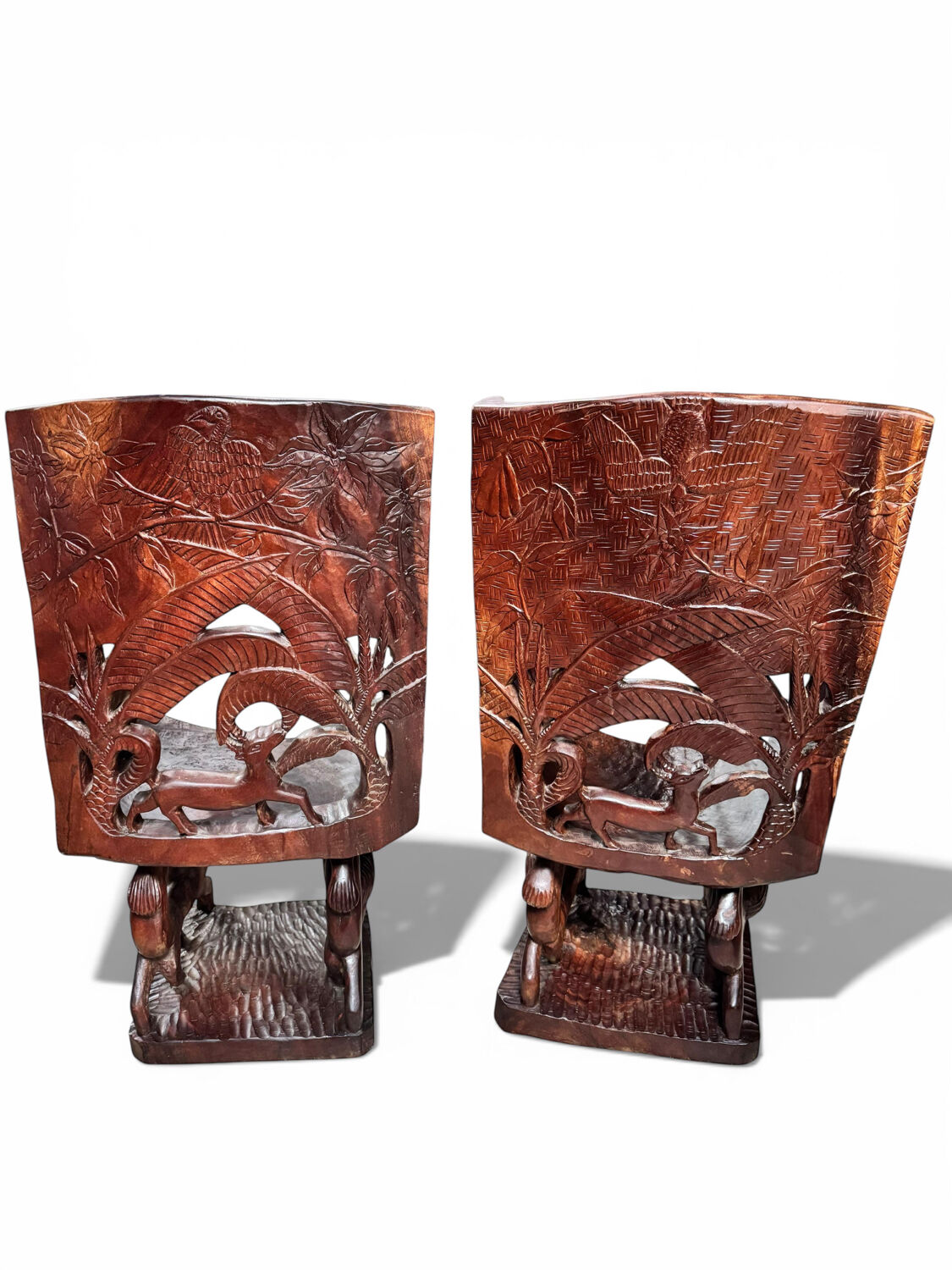 Pair of carved African armchairs