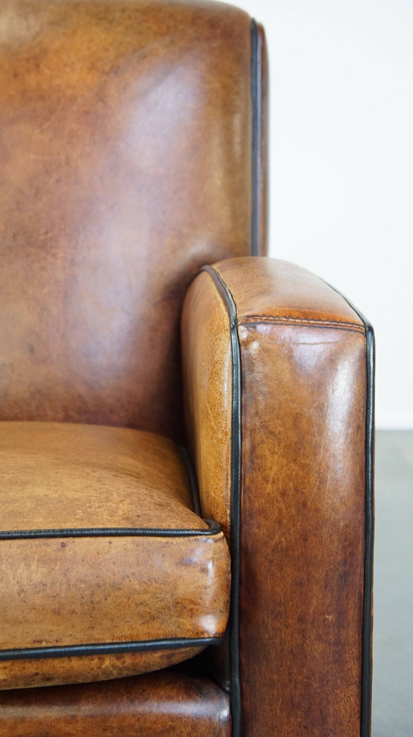 Art Deco sheep leather armchair with a lot of character