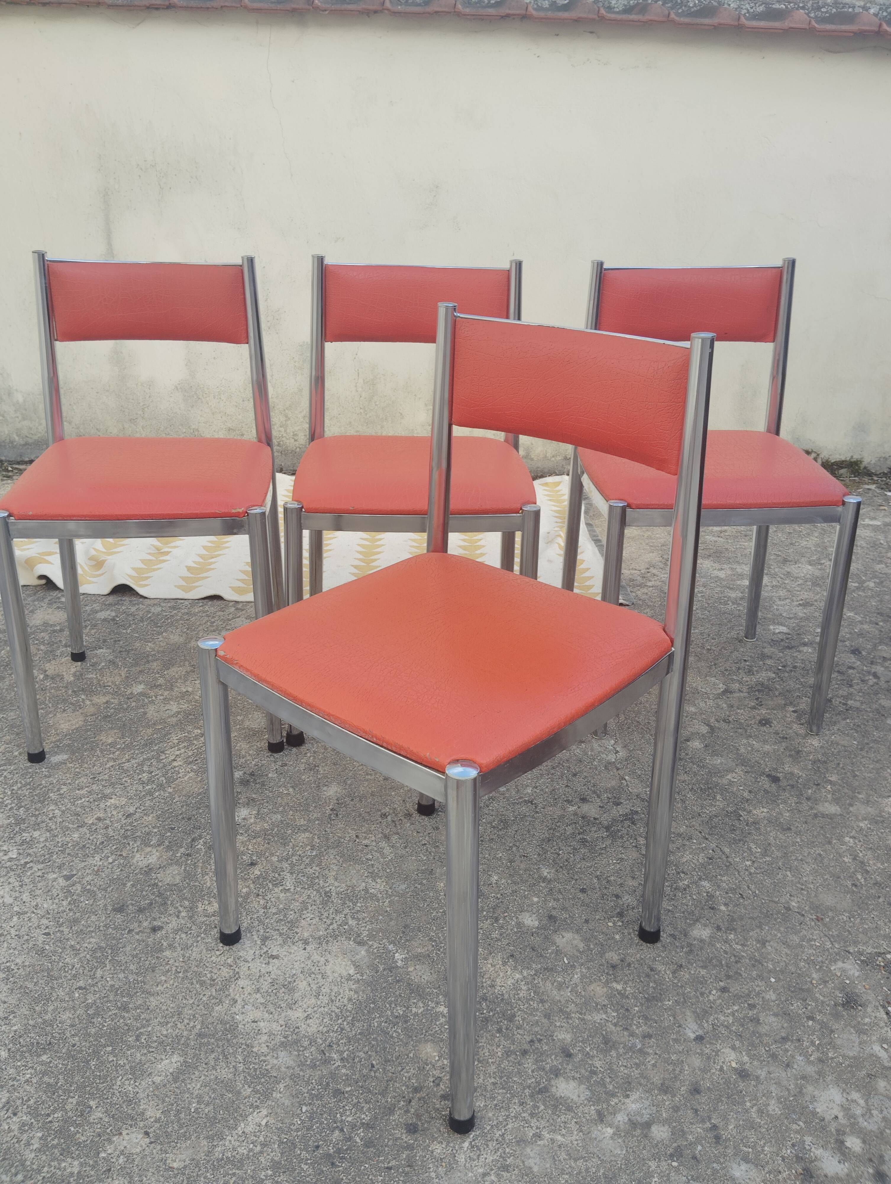 Set of 4 vintage chrome and orange faux leather chairs.
